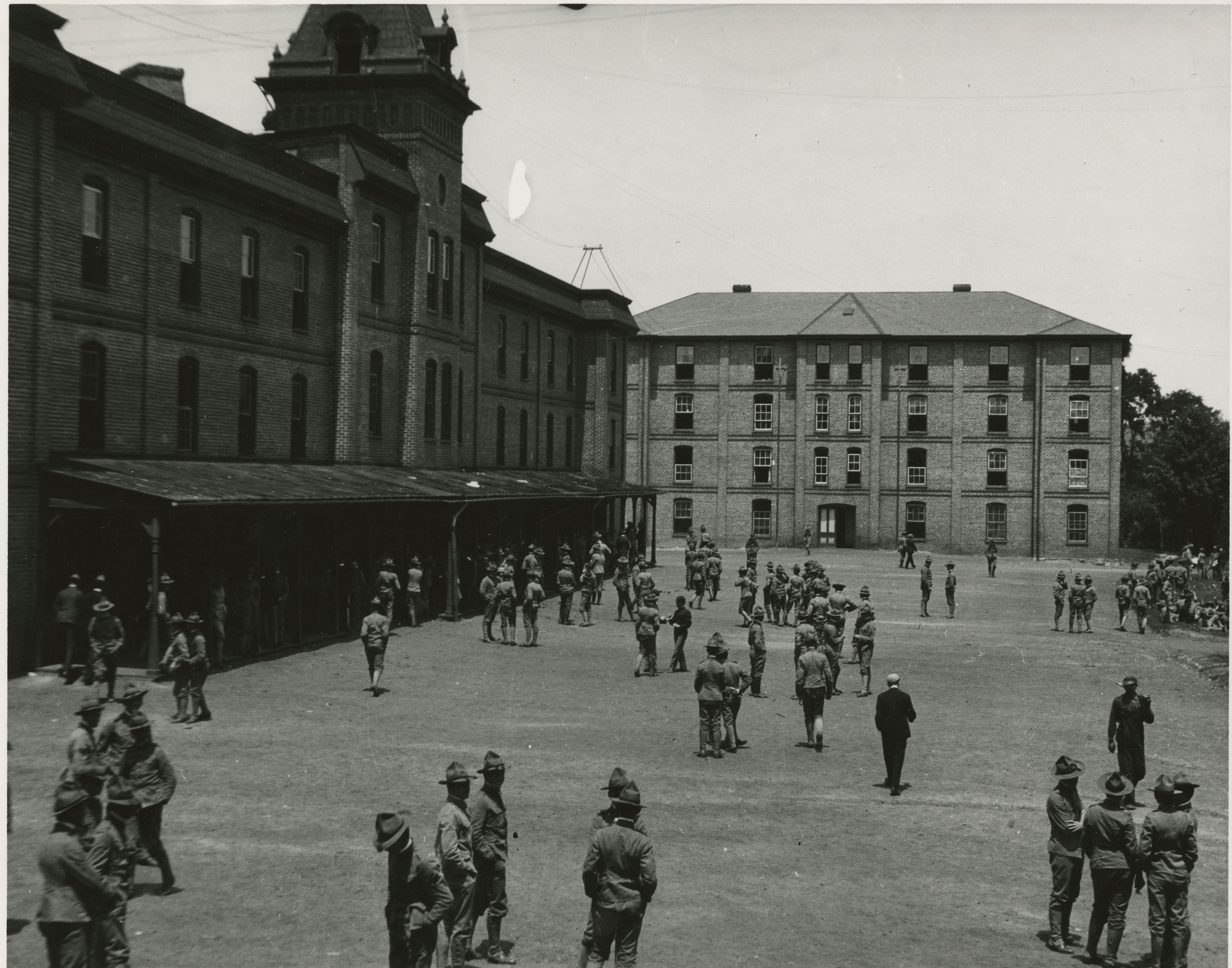 Upper Quad, before 1950. Barracks No. 1 (now Lane Hall) on the left. Rasche Hall (old Barracks No. 2 plus additions) at the center.