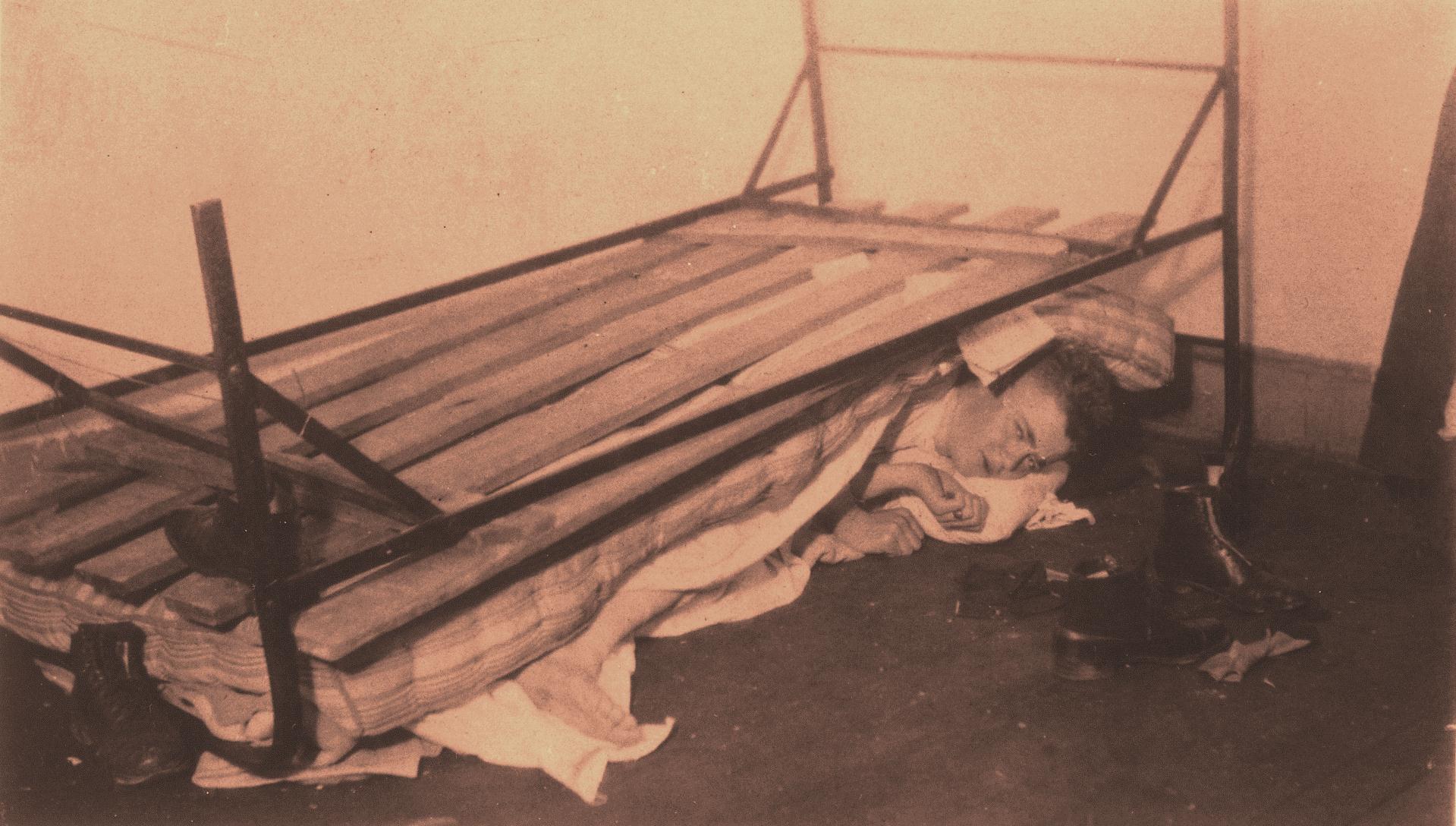 In the middle of any given night, a new student was likely to be dumped from his bed, a favorite practical joke inflicted by upperclassmen. This scene, probably staged, was photographed in 1899. 
