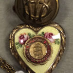 Button with VPI initials and locket with VPI seal