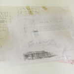 Architectural drawings and sketches in a folder