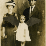 Family portrait with animated bat wings on little girl.